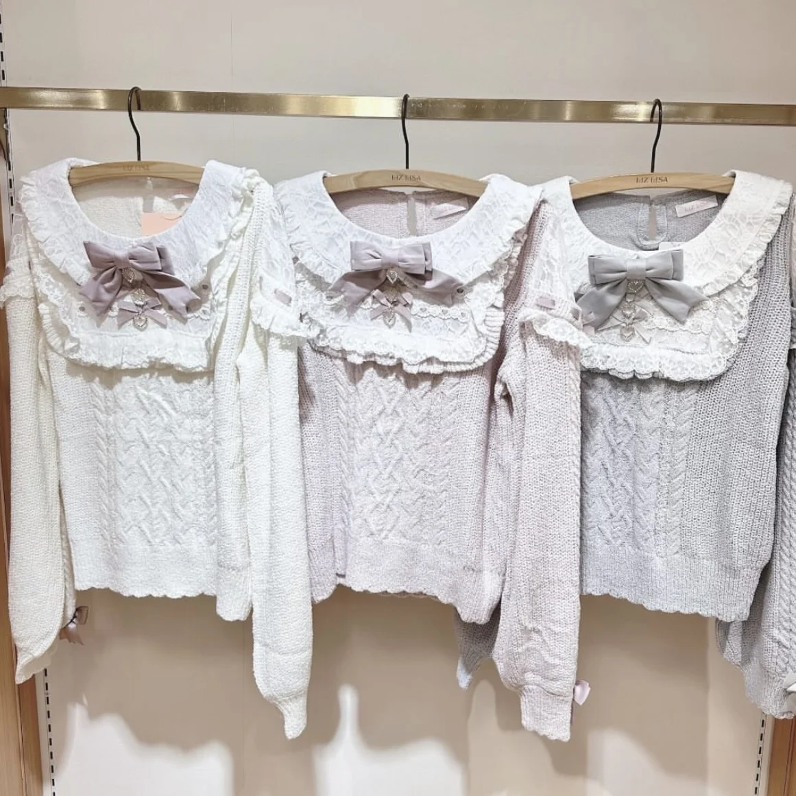 Женский трикотажный свитер с рюшами и длинным рукавом на осень/зиму