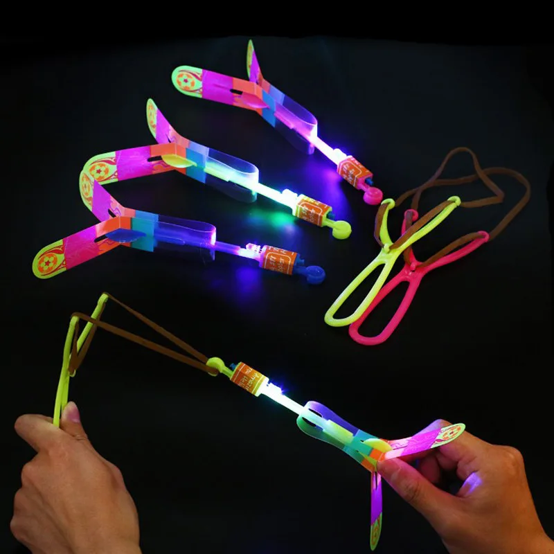 

5 Pcs Amazing Light Toy Arrow Rocket Helicopter Flying Toy LED Light Toys Party Fun Gift Rubber Band Catapult