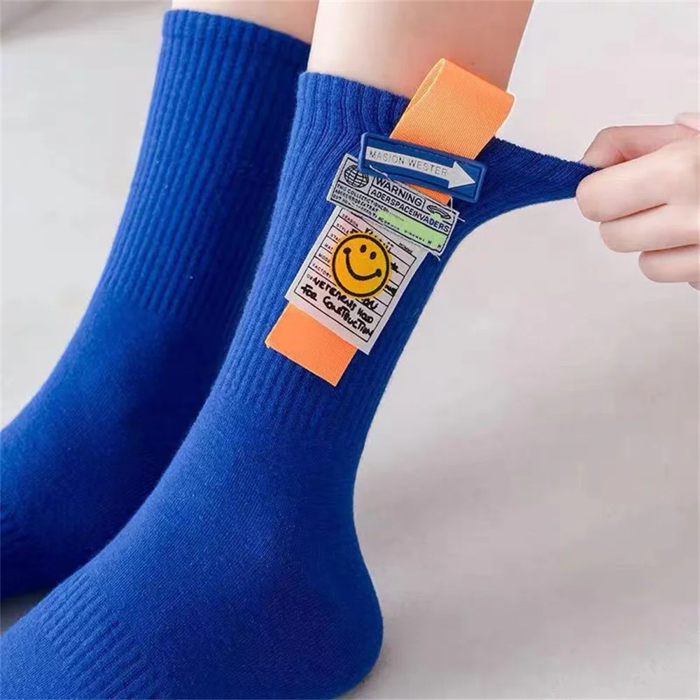 Cartoon smiling face fashionable fluorescent color medium tube socks Street hip hop basketball skateboard socks four seasons