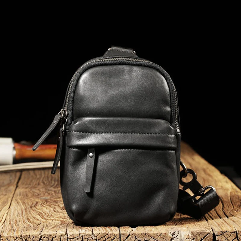 EUMOAN  Leather solid color messenger bag summer men's and women's trend chest bag vegetable tanned leather men's casual black b