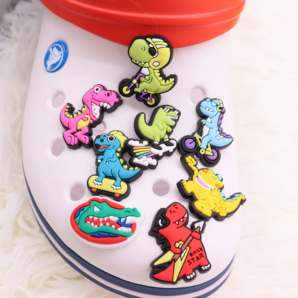 

Wholesale 50Pcs Tyrannosaurus Rex Sking Dinosaur Stegosauru PVC Shoe Charms Buckle Clog Decorations for Croc Jibz Wristbands