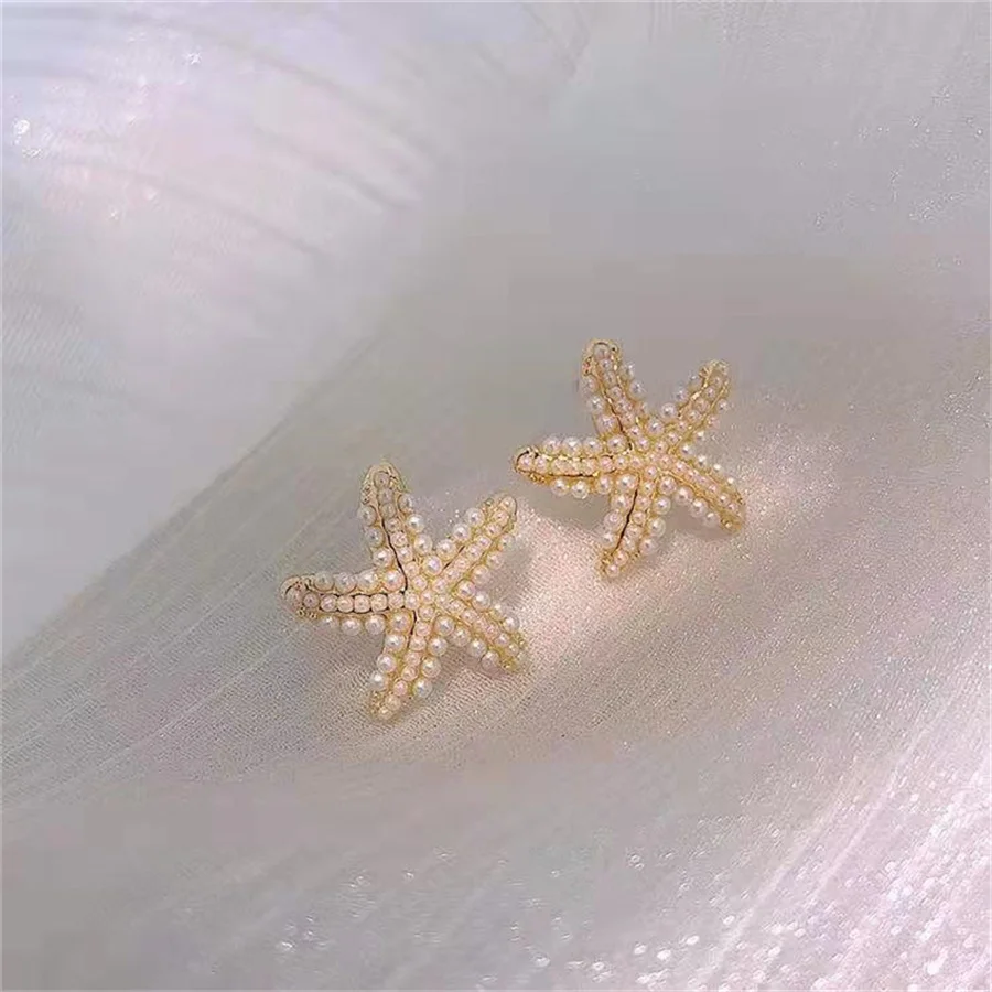 Женские серьги в виде морской звезды золотого цвета