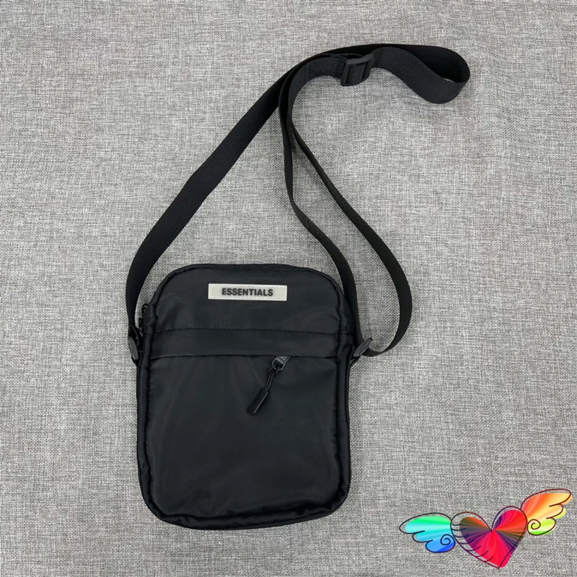 

2023 Basic Essentials Tape Logo Bags Men Women Black Nylon Essentials Backpacks High Street Zip 22*18cm Vertical Bag