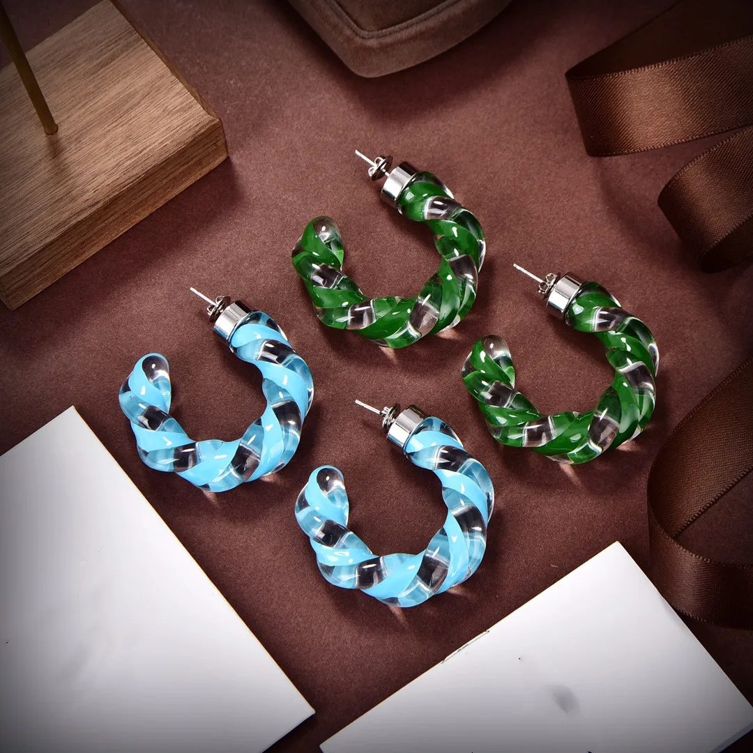 

European and American fashion simple commuting fried dough twist simple transparent resin C-type winding Earrings