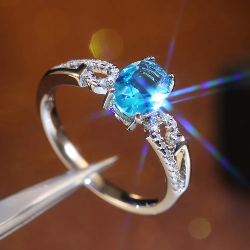 

Huitan Sky Blue Oval Stone Women Ring Auspicious Clouds Micro Paved CZ Classic Engagement Ring For Wife Best Love Luxury Jewelry