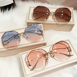 2022 Fashion Tea Gradient Borderless Sunglasses Women Ocean Water Cut Trimmed Lens Metal Curved Temp in India