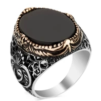 new european and american simple gold rimmed black gemstone mens two color embossed ring fashion to attend the banquet ring