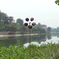 dual motion copper colored wind spinner outdoor garden metal art wind spinner with orb