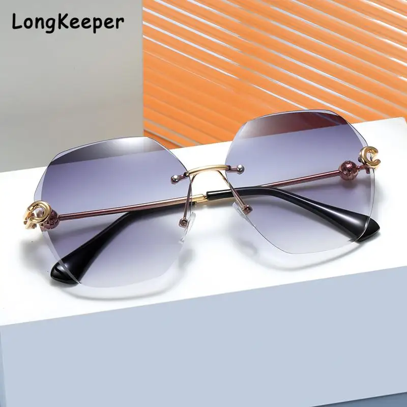 

Солнцезащитные очки без оправы UV400, модные круглые градиентные солнечные очки без оправы, из металлического сплава, с защитой от ультрафиол...