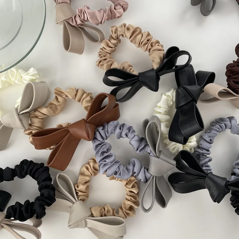 

Korean Style PU Bowknot Elastic Hair Band Silky Satin Hair Scrunchies Skinny Hair Tie Women Leather Head Band Hair Scrunchies
