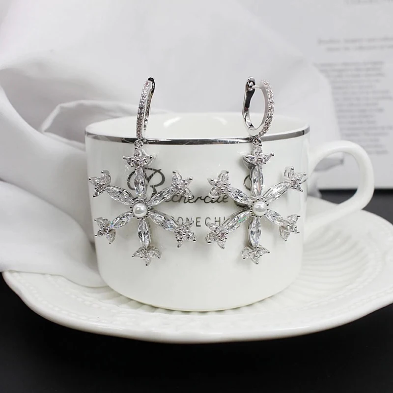 

925 sterling silver diamond-encrusted pearl snowflake earrings for women exaggerated personality design light luxury jewelry