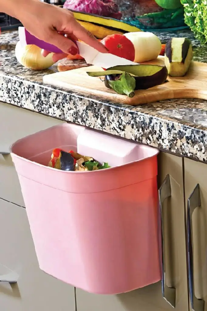 

Garbage bucket hanging on the cabinet