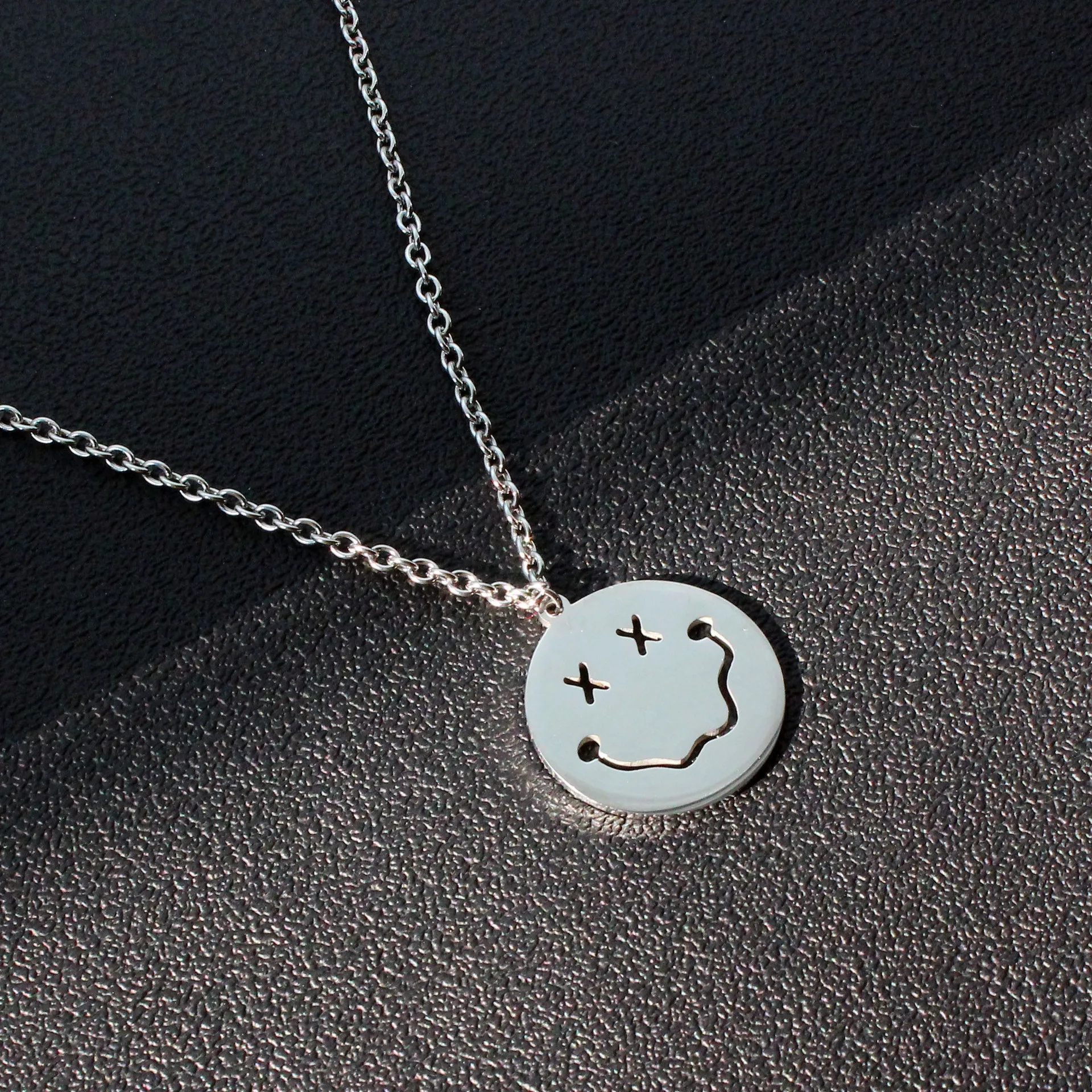 

Stainless steel funny smiley sweater clothes chain naughty expression bag pendant personality neutral ins net red