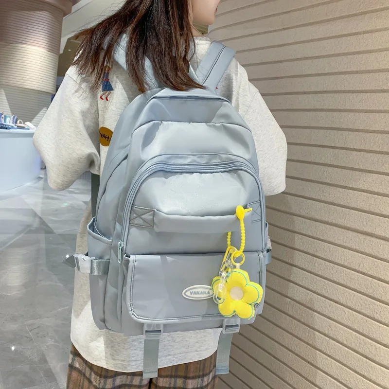 

Новинка Весна 2023, однотонный грязеотталкивающий универсальный рюкзак для пары для мальчиков и девочек, городской простой школьный портфель
