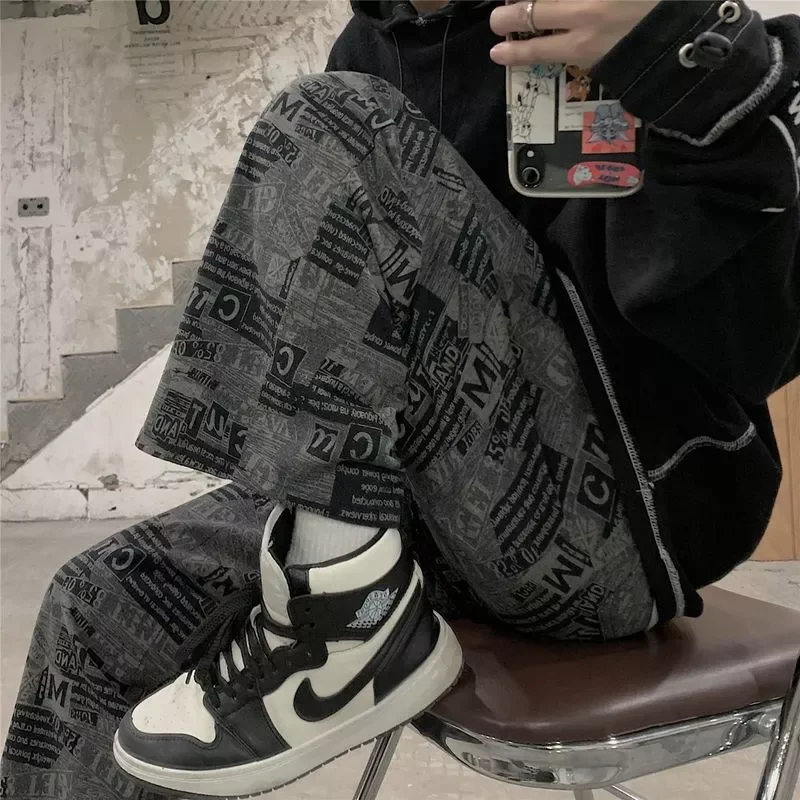 

NEW IN new straight pants men women students Korean loose newspaper letter printing vintage casual wide-leg high street trousers