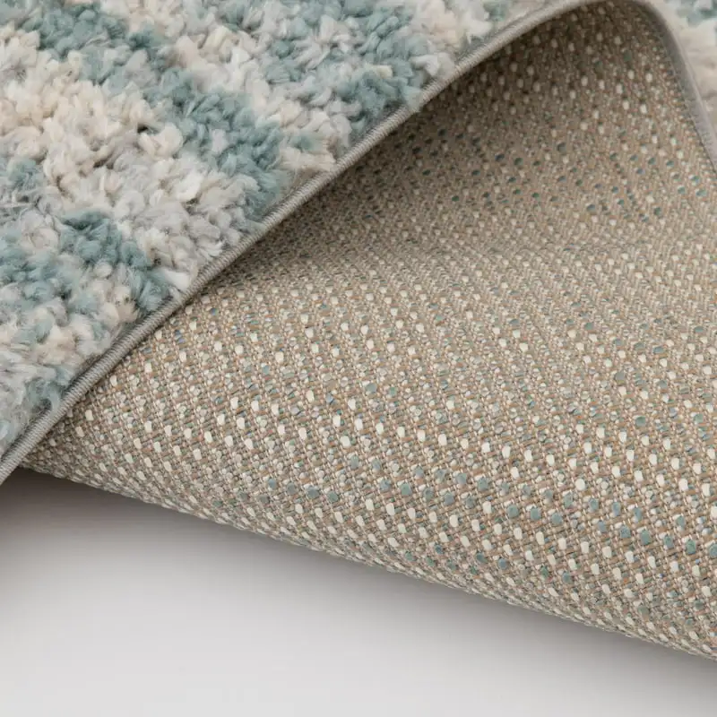 

x 7' Teal & Ivory Shag Area Rug