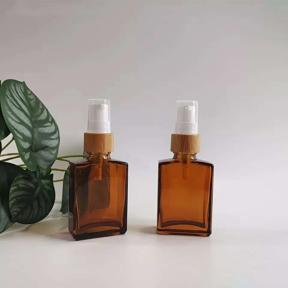 

Wholesale 30ml 1oz Pump Cosmetic Amber Square Empty Glass Lotion Soap Bottles with Bamboo Cap Cosmetics Refillable Travel Bottle