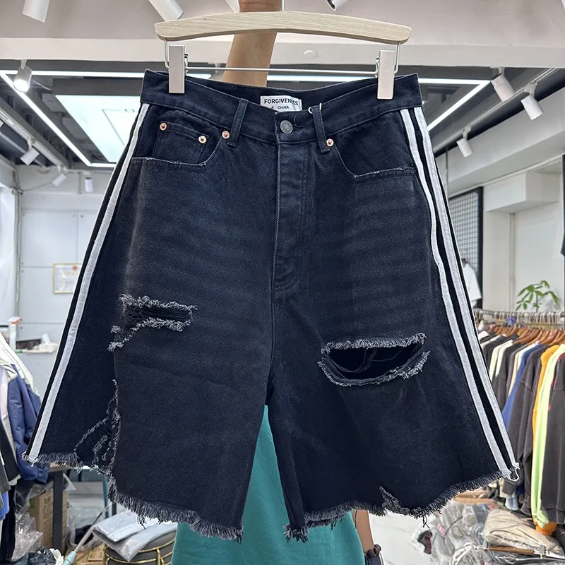 

Worn out denim damaged ripped shorts