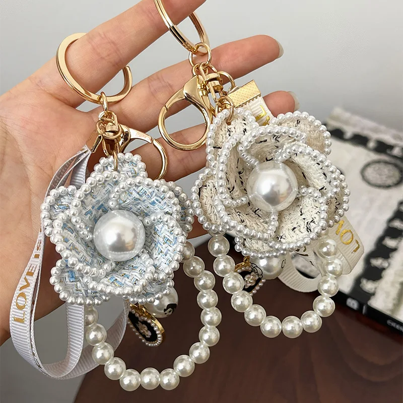 

Korean version of Buyishan Camellia Key Chain Ribbon Pearl Handmade Key Chain Fashion Bag Pendant Automotive Accessories