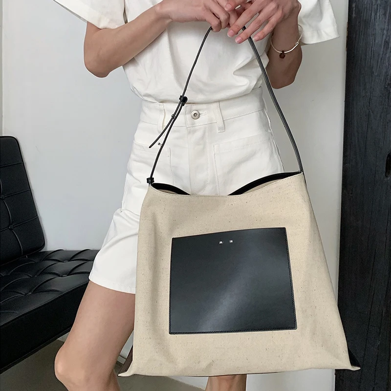 

22ss new Jil canvas bag large capacity cloth bag minimalist design cow leather jacket layer high quality sander Satchel Handbag