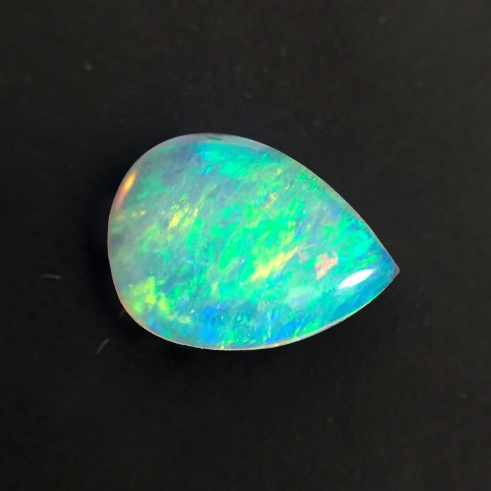 

Натуральный семицветный опал яйцо 7x9 мм