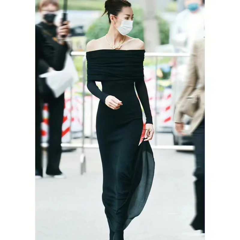 

22-year-old Liu Wen starlet in black, hepburn-inspired sheer dress with strapless waist and one-quarter-length skirt