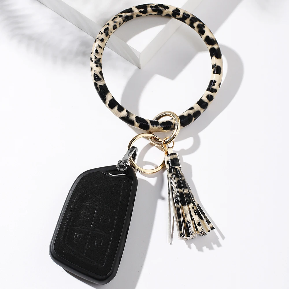 

ArtiLady Key Chains for Women Leather Tassel Round Keychain Wristlet Bangle Key Holder Bracelet Car Keyring Gift for Girlfriend