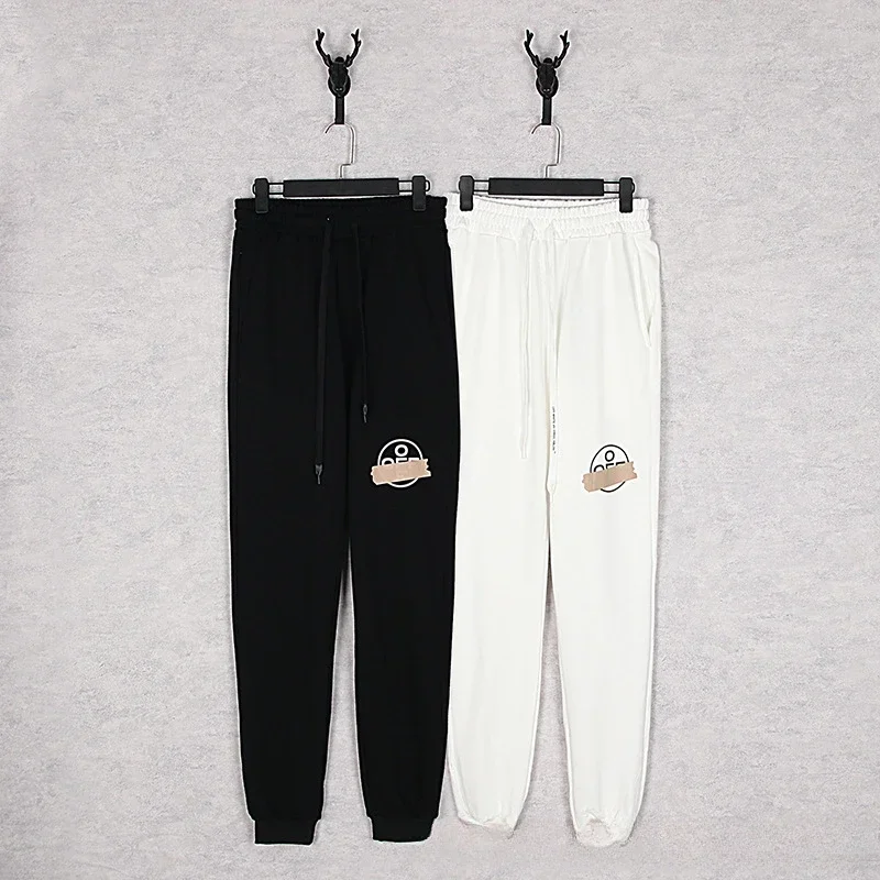 

New tide spring and fall models OFF white gold classic airport rubber stripe casual pants men and women with the same models