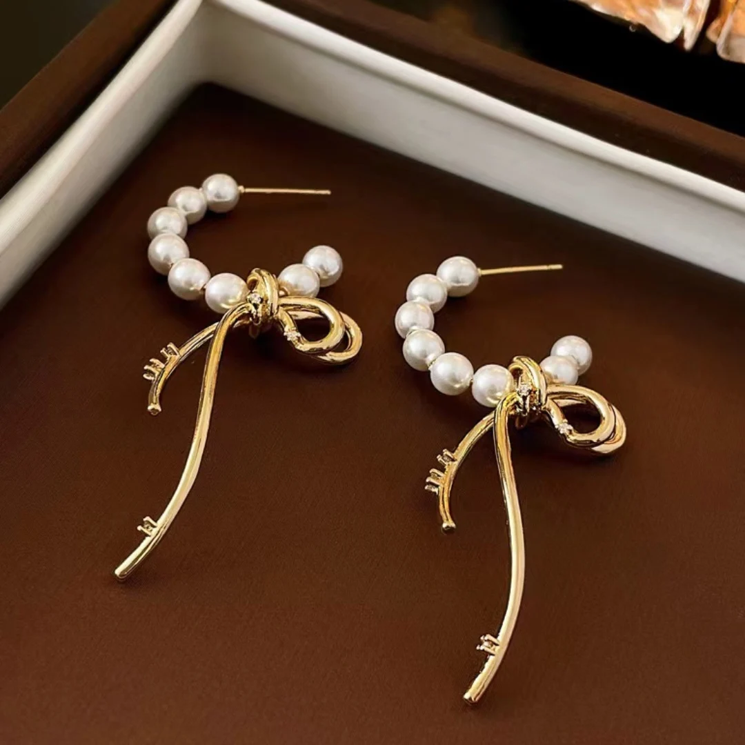 

Golden Stainless Steel Bow Dangle Earring Pearl C-letter Design with Sparkling Zircon Accents for Luxury women's Jewelry