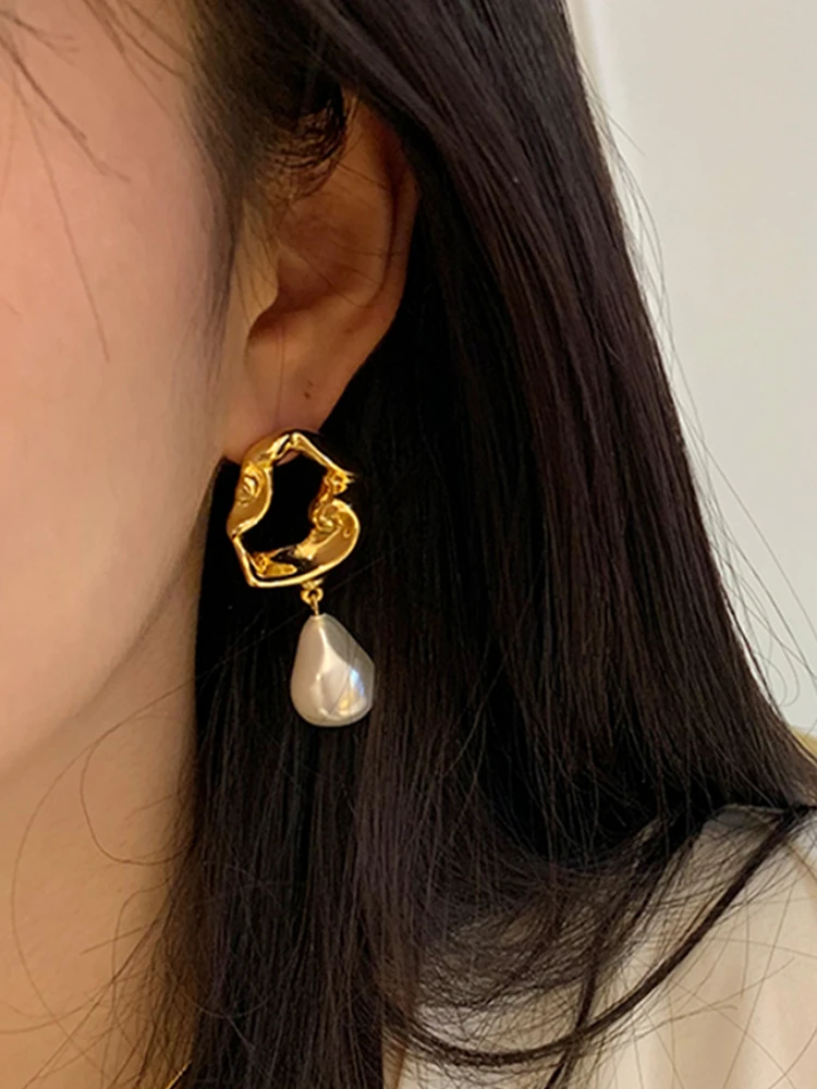 

kshmir Novel retro metal hollowed out lava irregular Baroque pearl pendant women's long exaggerated earrings