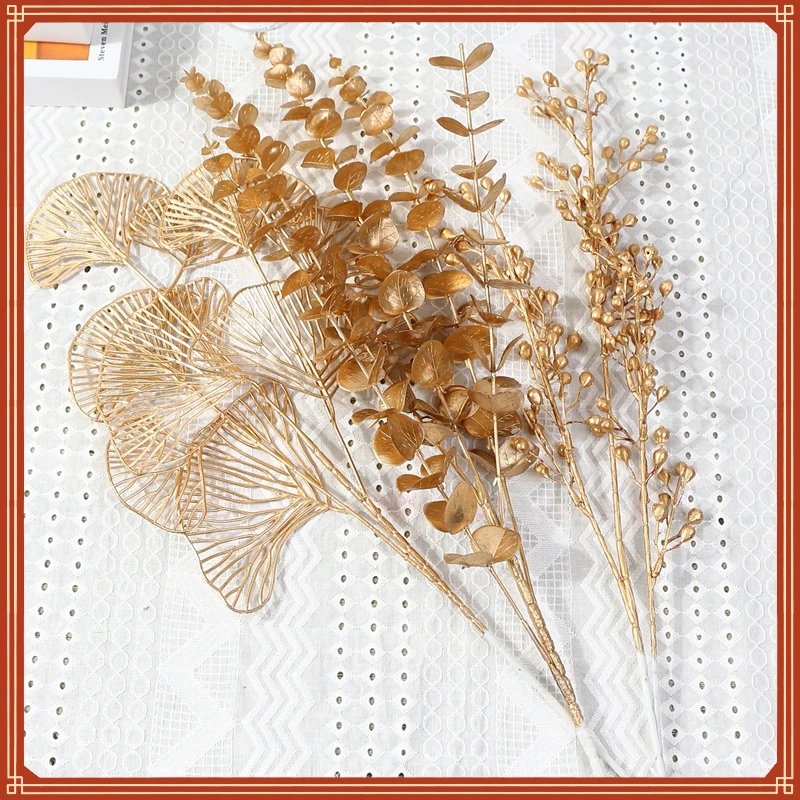

New in Gold Artificial Plants Holly Ginkgo Eucalyptus Leaf Fake Flowers Wedding Decorations Home Room Table Decor New Year 2022
