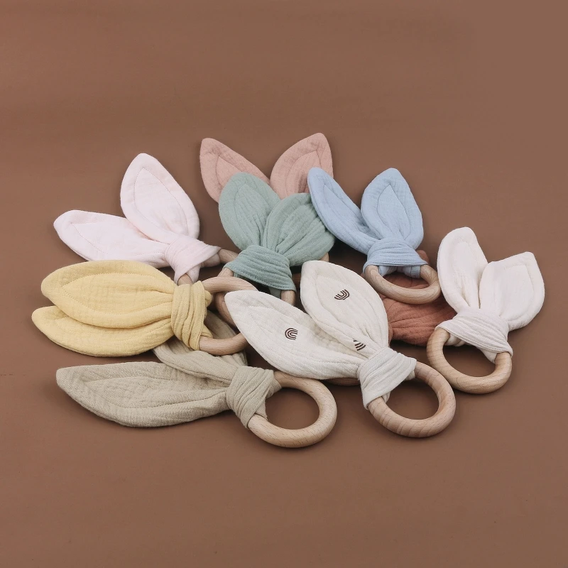 

Безопасная детская деревянная игрушка для рук из мягкого хлопка с милыми кроличьими ушками, удобная игрушка, кольцо для прорезывания зубов,...