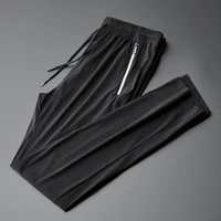 mens sports leisure spring summer quick drying breathable ice silk pants youth new thin fashion trend elastic 9 point trousers