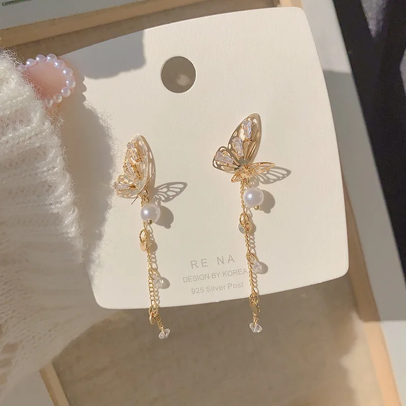 

Korean temperament hollowed out butterfly tassel long silver needle three-dimensional pearl crystal retro fashion women earrings