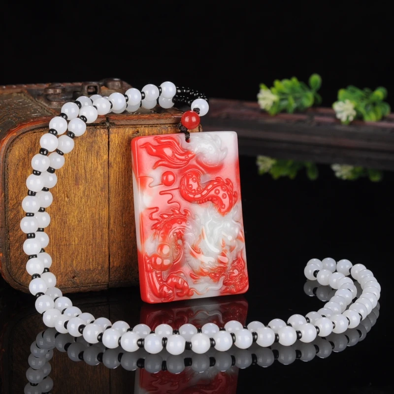 

Jade dragon pendant men's and women's jade pendant Xinjiang Hetian jade chicken blood jade color jade zodiac dragon safe brand