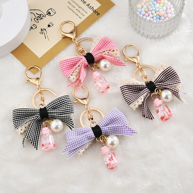 

Модные оригинальные аксессуары с бантом и жемчугом, брелок с плавающей жидкостью и подвеской в виде зыбучего песка в бутылке, брелок для жен...