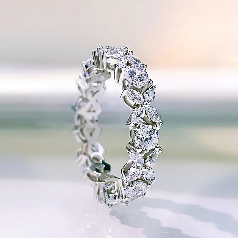 

The new S925 sterling silver multi-cut diamond ring small diamond row ring XO olive-shaped round women's wholesale