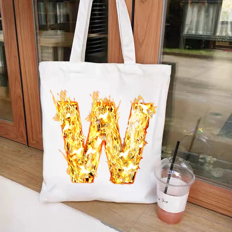 

Burning Fire Alphabet Letter Printed Canvas Shoulder Bags Female Harajuku Graphic Shopper Shopping Totes Travel Casual Handbags