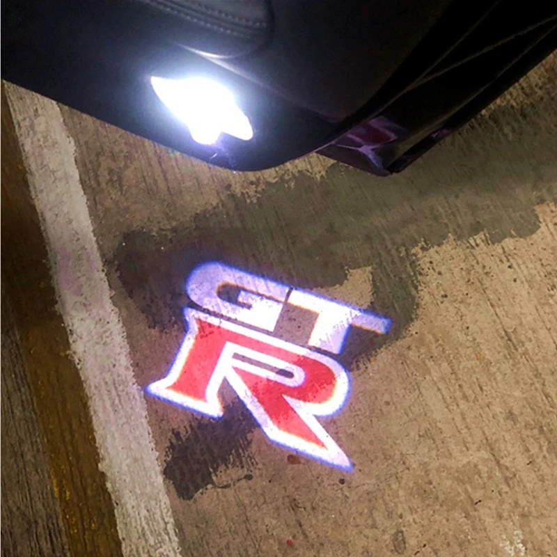 

2PCS LED Car Door Logo Lights Courtesy Laser Projector For Nissan GTR R35 R34 Welcome Warning Lights Decora Accessories