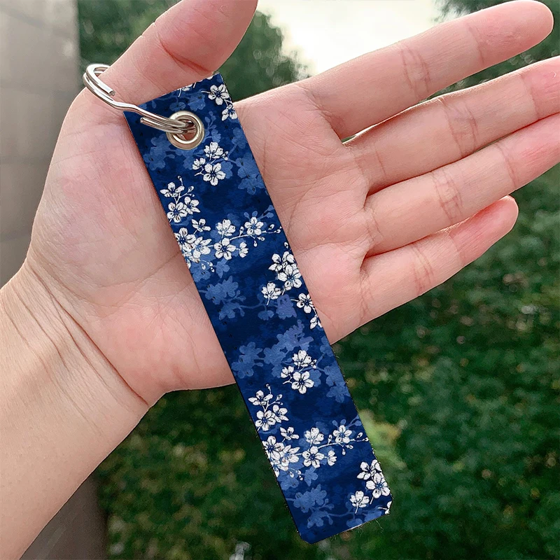 

Sakura blossom in deep blue leather motorcycle Key chain Strap Keyrings Hanging Holder Bag Wallet Trinket Keychain Hanging Bag