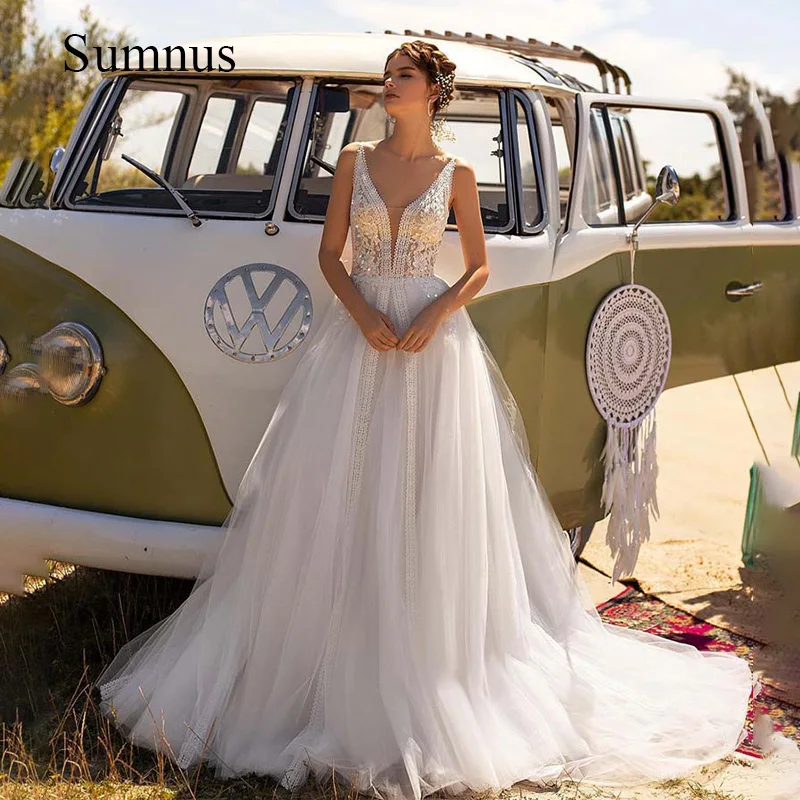 

Bohemian Wedding Dresses Deep V Neck Tulle Lace Appliques A Line Bride Dress Sleeveless Princess Wedding Gowns Back Button