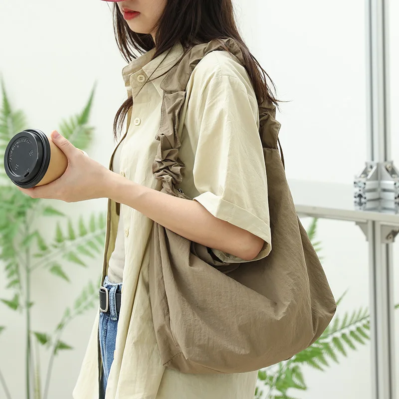 

Japanese casual drawstring handbag ins small fresh pleated one shoulder women's bag net red fashion nylon fabric messenger bag