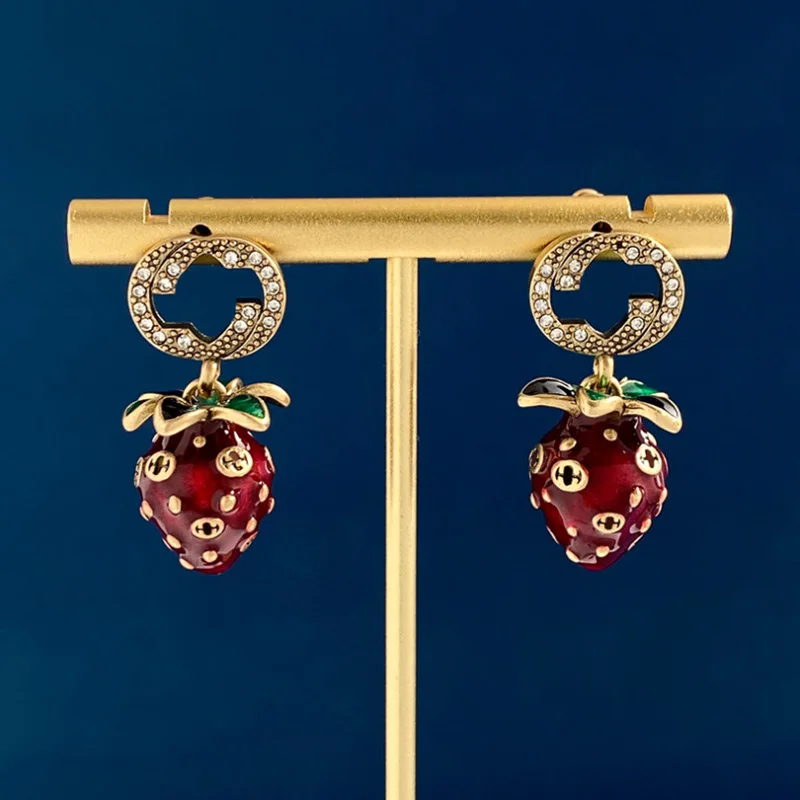 

Tonya jewelry fashion hollow titanium steel micro-inlaid AAA zircon strawberry silver needle luxury retro earrings