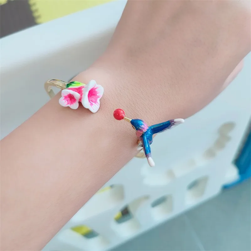 

Adjustable Metal Plated Gold with Enamel and Hummingbird Flower Topaz Bracelet