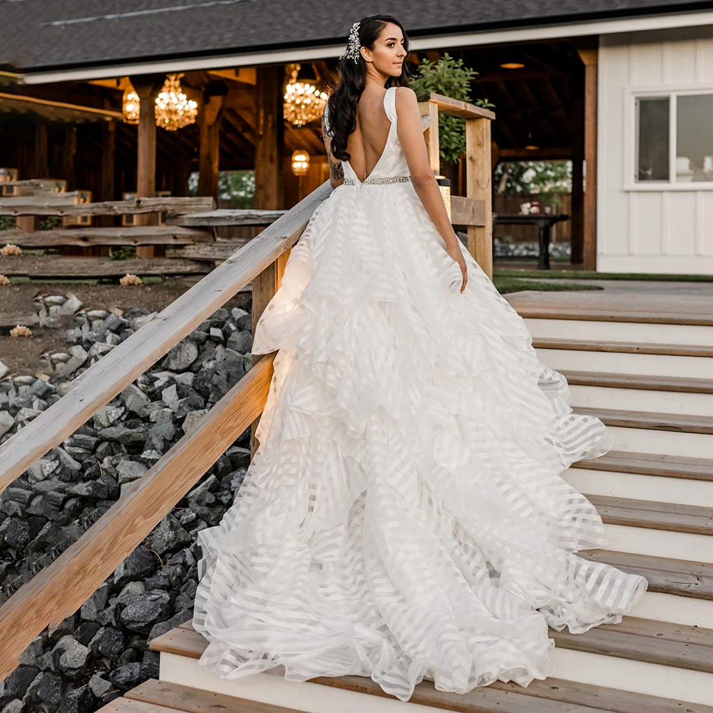 

Cascading Ruffled Tiered Tulle Wedding Dress Puffy Backless Beach Elopement V Neck Luxe Zebra Print Striped Modern Bridal Gown