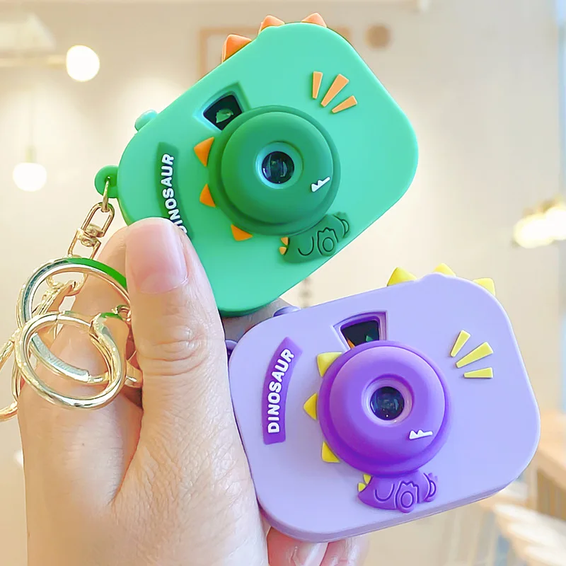 

Необычный маленький динозавр камера пряжка калейдоскоп проектор кнопка переключатель сплав брелок сумка милый маленький кулон ювелирные ...