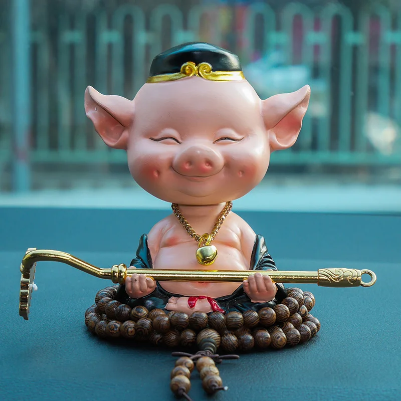 

Creative Shaking Head Cute Marshal of the Heavenly Canopy Pig Eight Ring Car Interior Decoration