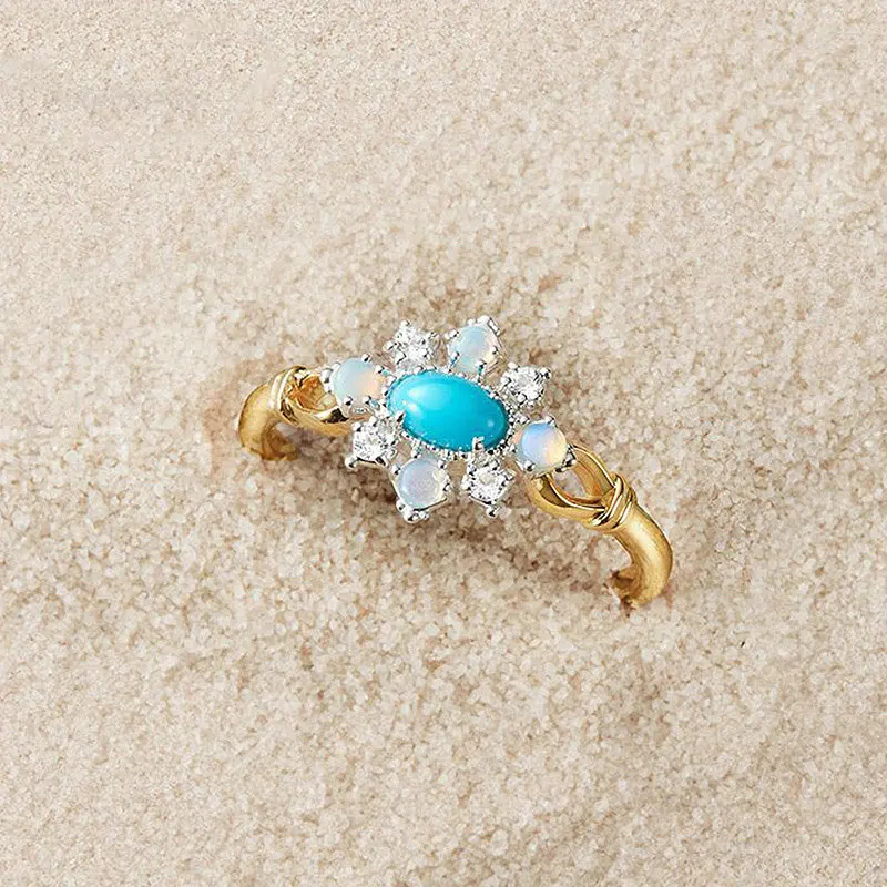 

Женское кольцо с опалом, топазом и бирюзой