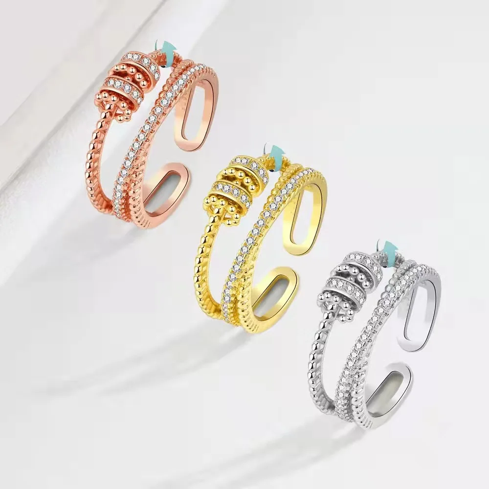 

New Stress Relief Transfer Swivel Bead Copper Micropaved Zirconia Ring