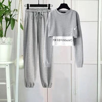 sweater womens spring and autumn new niche design sense stitching short fake two piece long sleeved top tide pants suit